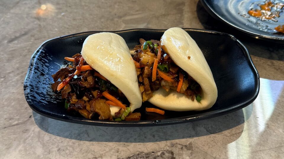 Steamed bao buns filled with pork belly at Tachi Ramen & Tea Bar