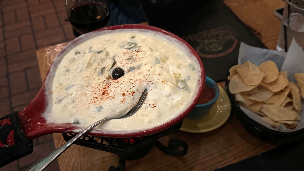 Creamy Artichoke and Jalapeños con Queso with melted cheese, artichoke hearts, and sliced jalapeños served in a hot ceramic skillet at Pancho’s Mexican Restaurant in Summerlin.