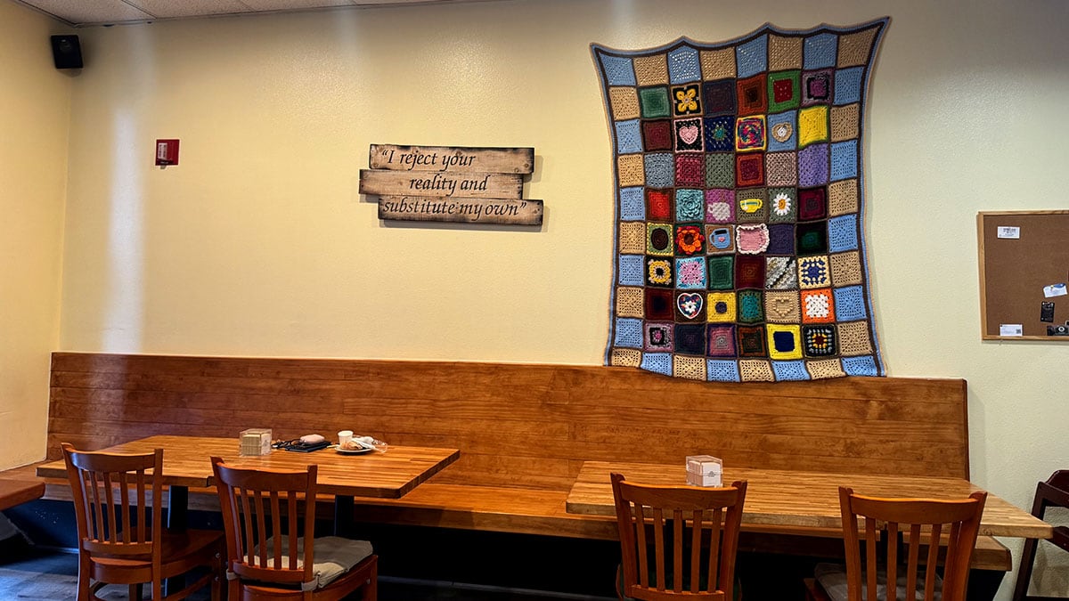 Comfortable seating area inside Convo Coffee House in Northwest Las Vegas with tables, chairs, and inviting décor.