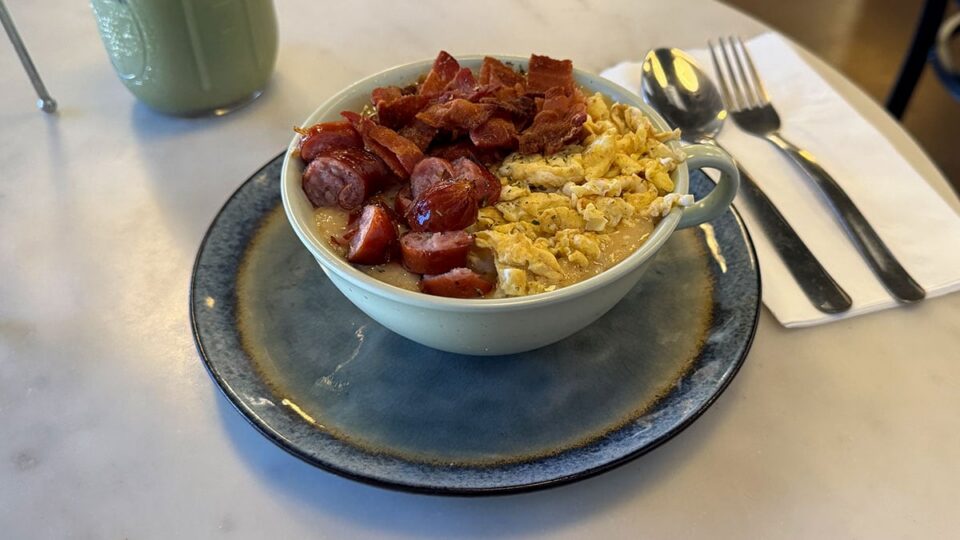 Cajun breakfast risotto with scrambled eggs, kurobuta sausage, bacon, and cheddar at Cafe Mong.
