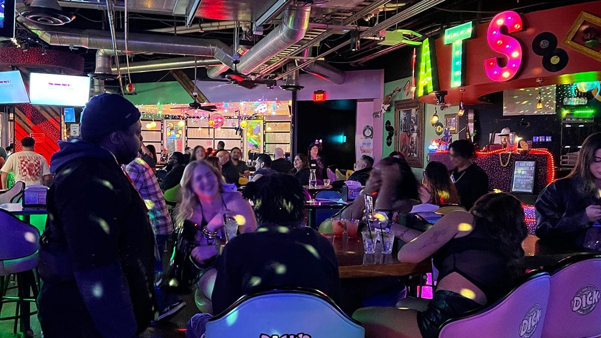 Crowded interior of Cat’s Meow karaoke bar with guests socializing and enjoying drinks in Downtown Las Vegas