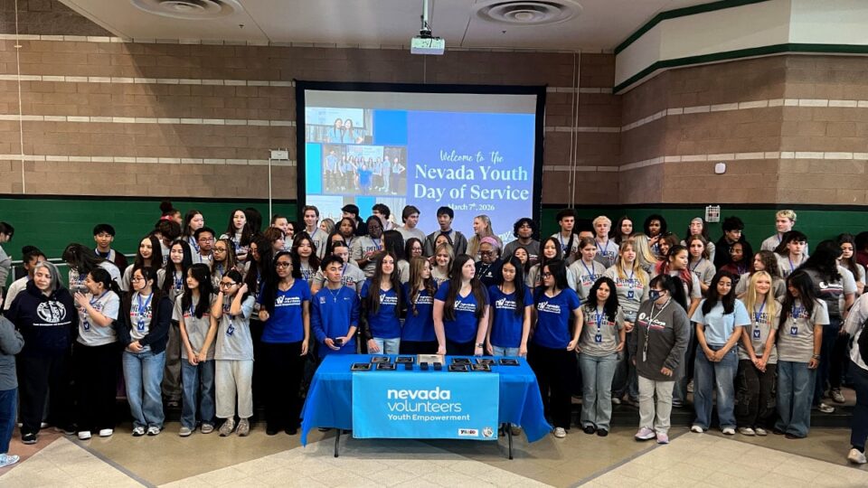 Sophia Booth posing with volunteers at Nevada Youth Day of Service