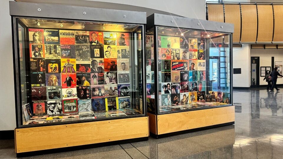 Memorabilia and artwork displayed in glass cases inside Sahara West Library in Las Vegas