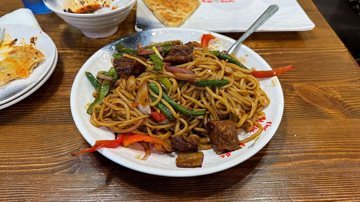 fresh handmade noodles topped with tender braised pork belly at The Magic Noodle Las Vegas.