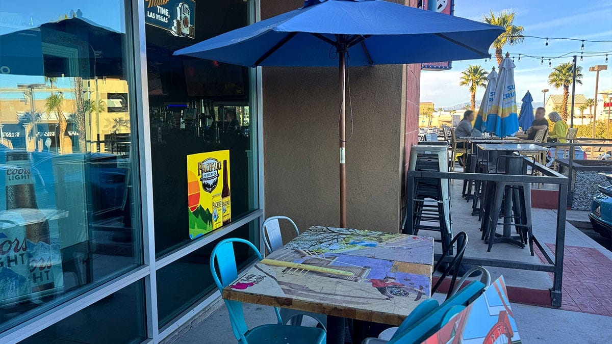 Outdoor seating area at Wahoo’s Fish Taco in Boca Park with patio tables and casual dining atmosphere.