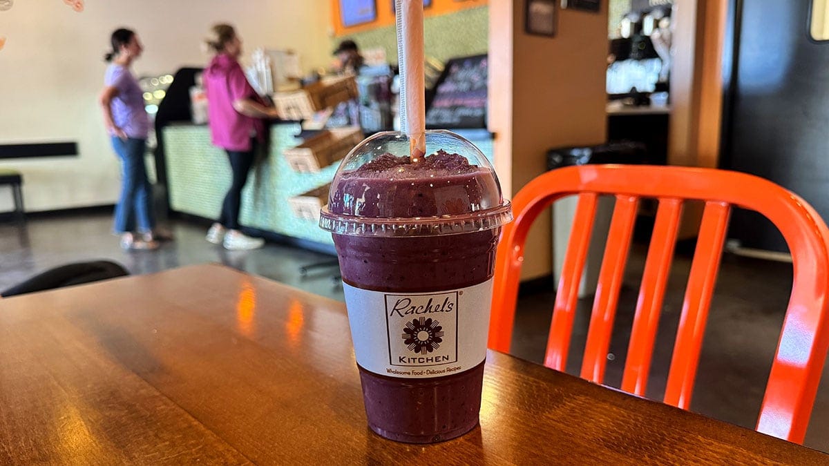 Acai smoothie from Rachel’s Kitchen served in a cup, made with blended fruit for a refreshing and nutritious drink