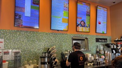 behind the counter at Rachel’s Kitchen Summerlin serving customers in a casual, health-focused restaurant setting