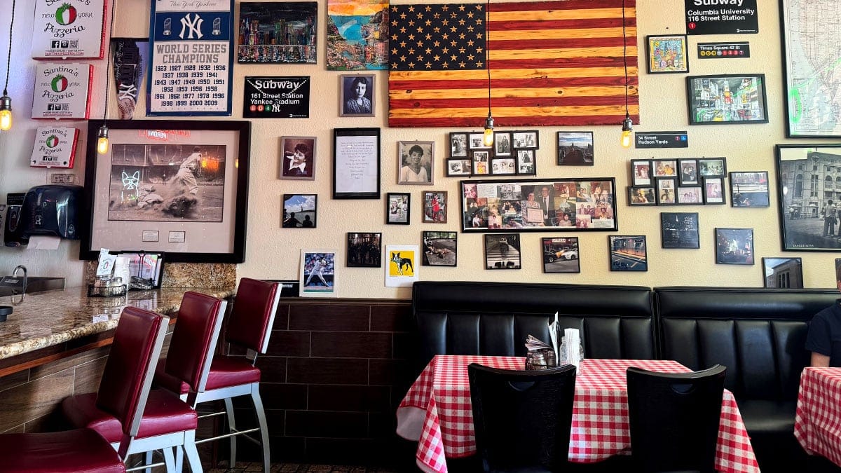 Interior dining room with tables and seating at Santina’s New York Pizzeria in Las Vegas.