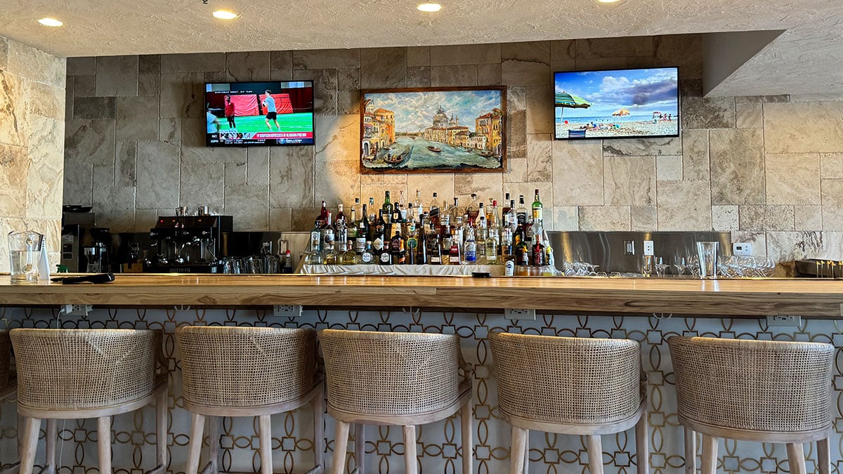 full bar setup inside novella italian kitchen with wine and cocktails