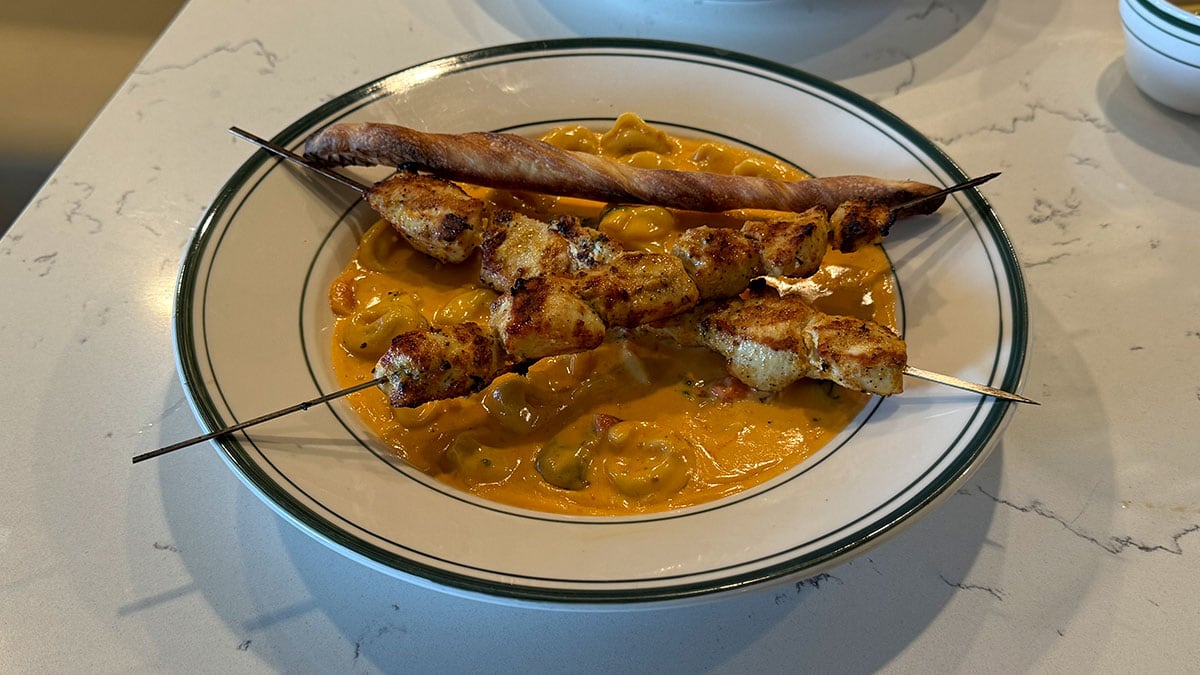 tortellini alla rosa with grilled chicken skewers at novella italian kitchen