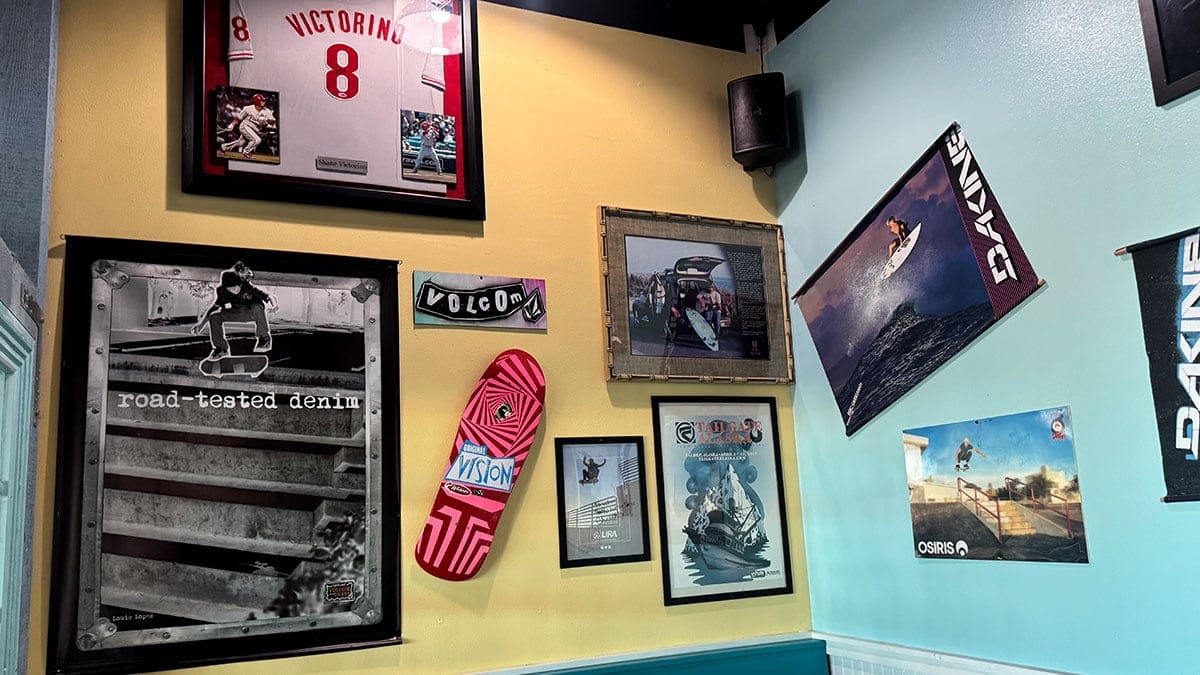 Interior décor at Wahoo’s Fish Taco in Boca Park with surf-themed artwork, bright colors, and a lively sports bar atmosphere.