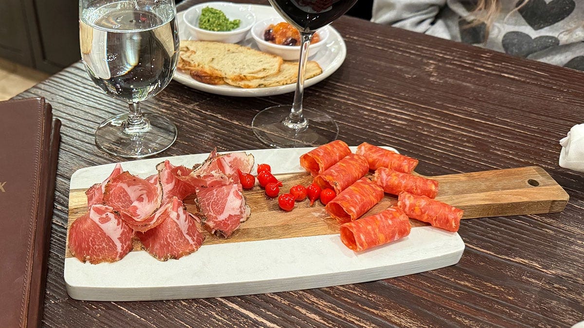 a charcuterie board with meats and cheeses served at charleston peak winery in pahrump nevada