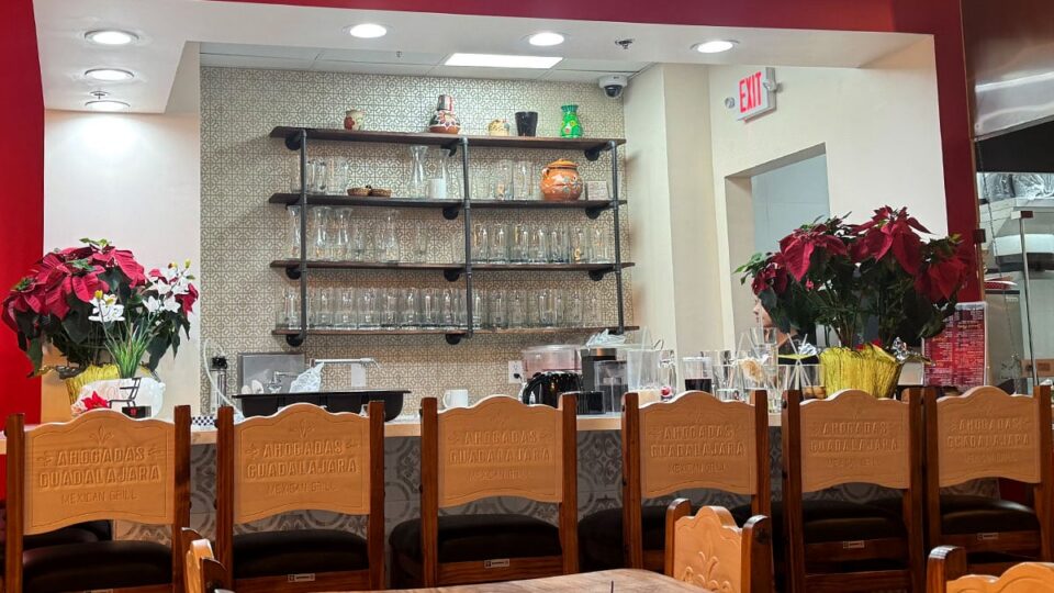 Bar seating area inside Carnitas y Tortas Ahogadas Guadalajara with modern decor