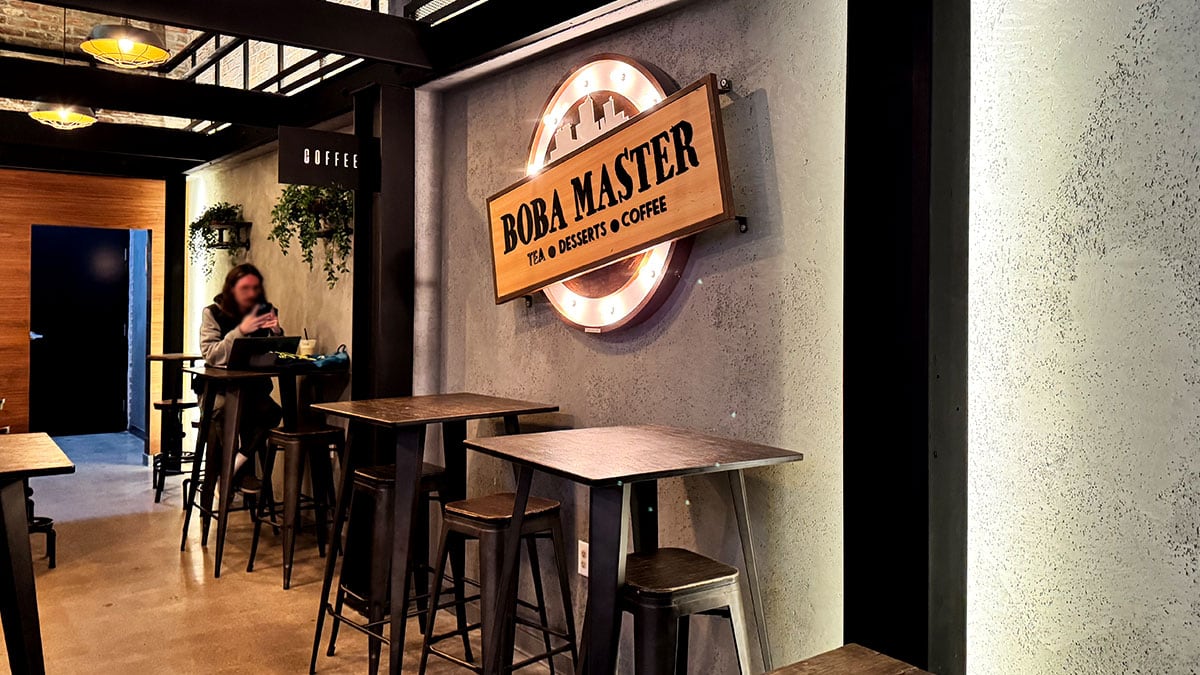 seating area inside Boba Masters with tables and comfortable chairs
