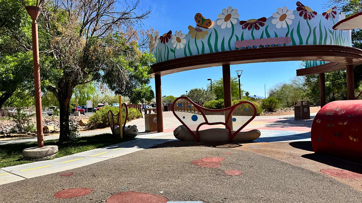 kids playground with small slides and play structures at Centennial Hills Park