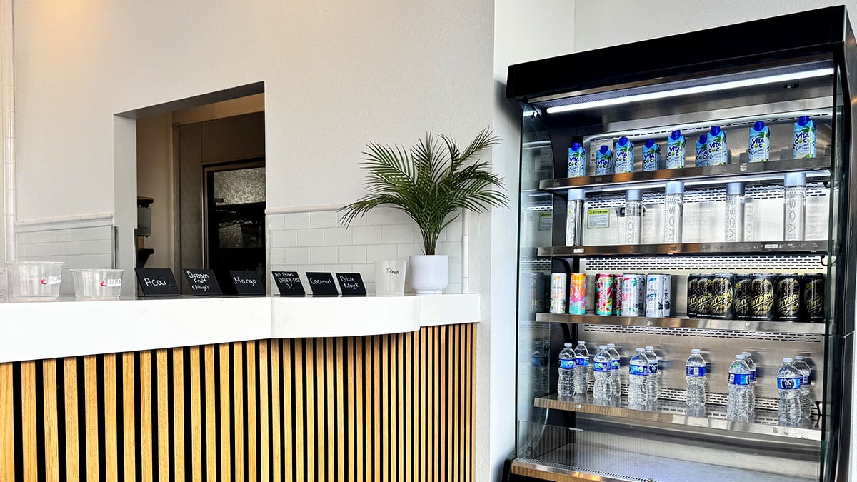 front counter at Bowlify Superfoods with toppings and prep area visible