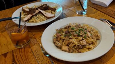 Date night setup with food and drinks at Grape Street Wine Bar in Downtown Summerlin