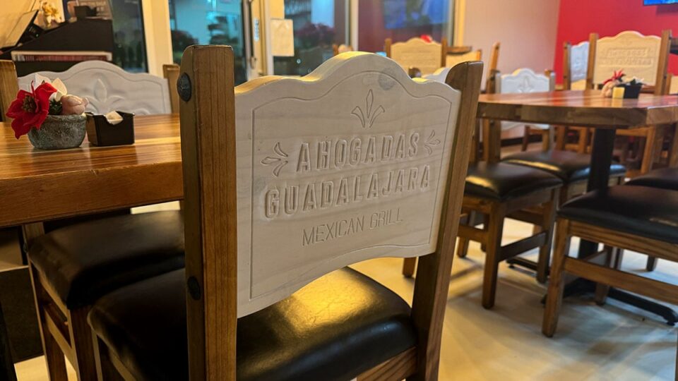 Wooden chairs engraved with Ahogadas Guadalajara branding