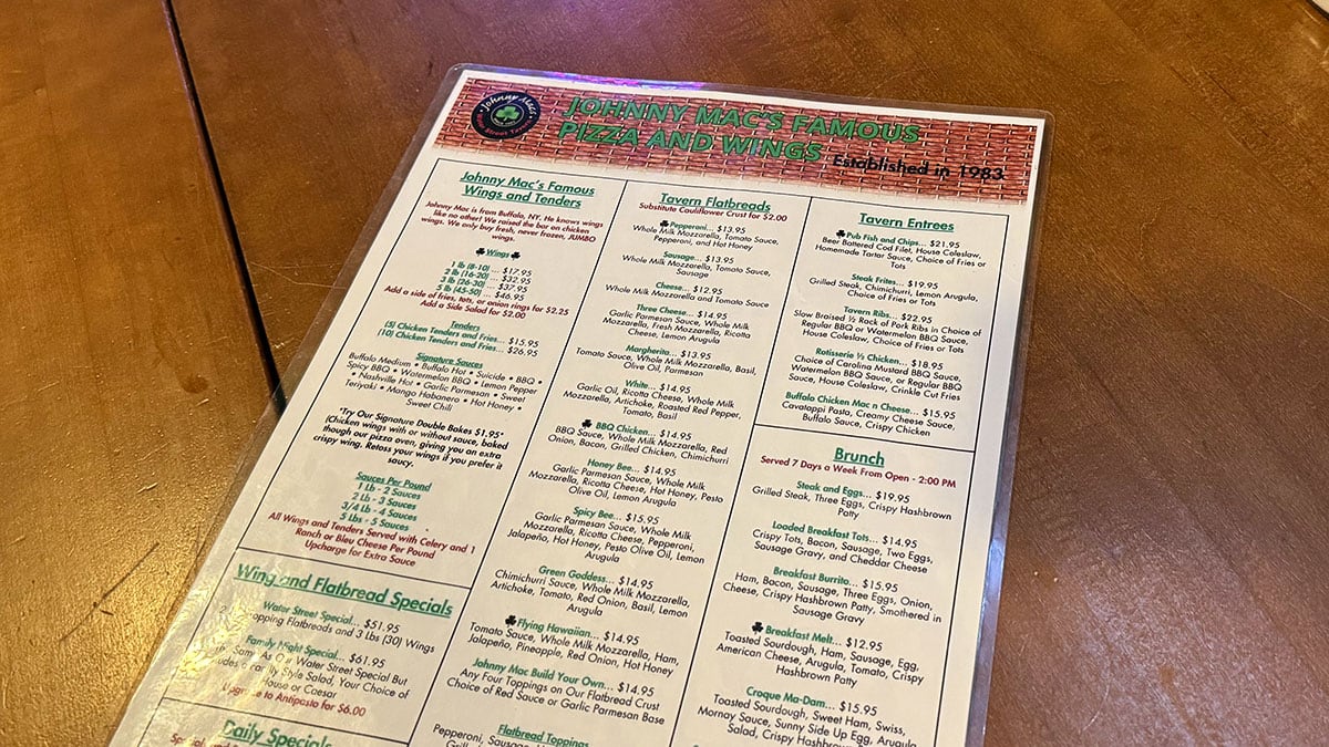 Jonny Mac’s Water Street Tavern menu displaying a variety of food and drink options including appetizers, wings, sandwiches, and beverages.