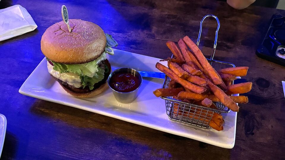 Juicy Lucifer stuffed burger with sweet potato fries at Evolve Brewing Project.