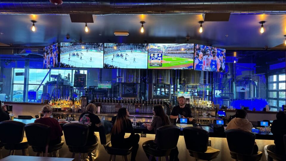 Guests enjoying drinks inside Evolve Brewing Project.