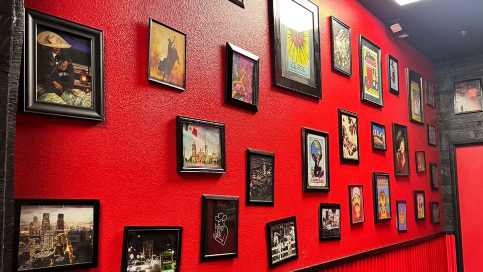 Photos and wall art inside Tacos Los Barrios showing Mexico, Las Vegas, and ranchero imagery.