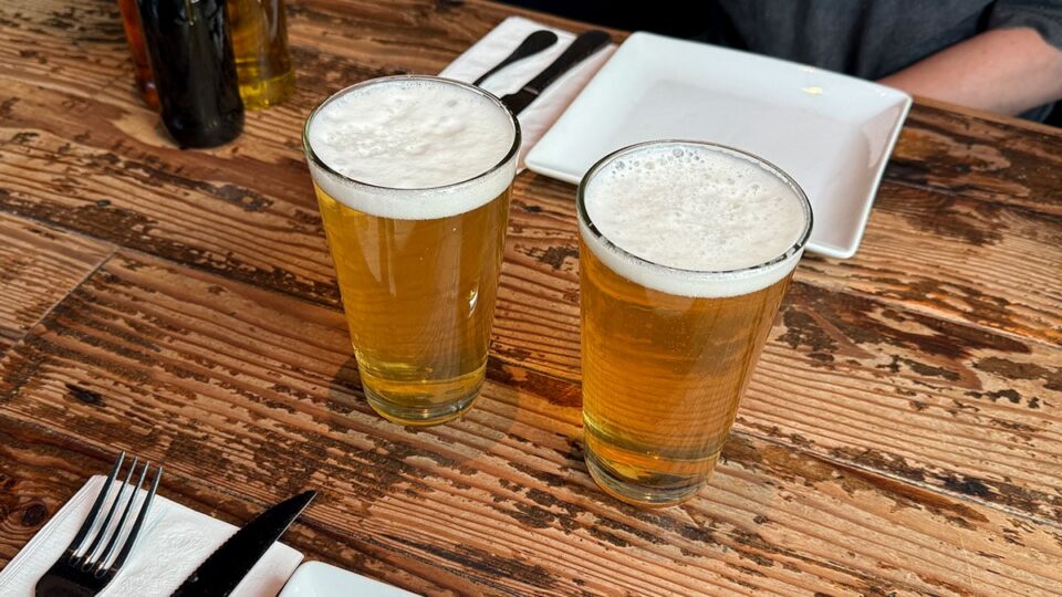 Glass of Settebello Blonde draft beer served cold at the bar