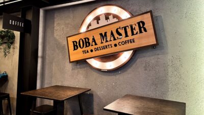 Boba Masters logo sign displayed inside the shop on the wall