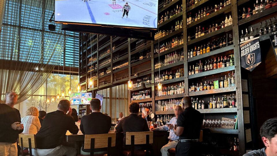 Bar area inside Grape Street Wine Bar with seating and wine display