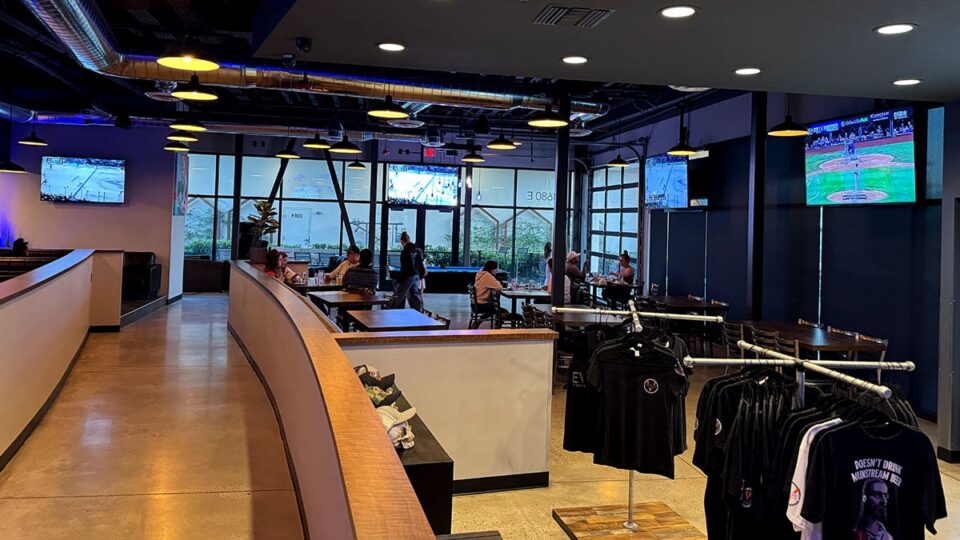 Evolve Brewing Project interior divided between family area and bar section.