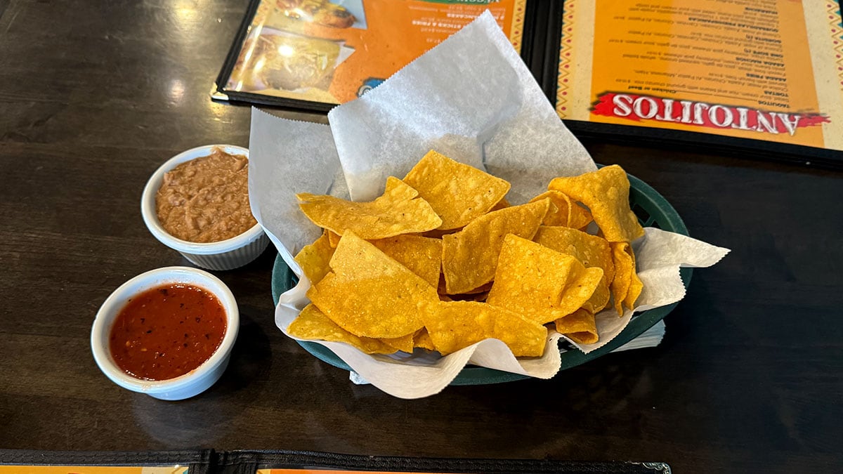fresh chips salsa and refried beans served at chile caliente restaurant