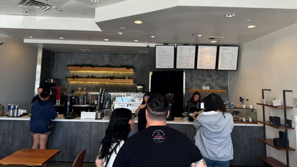 Customers standing in line inside Aware Coffee in Centennial Las Vegas during a busy morning rush.
