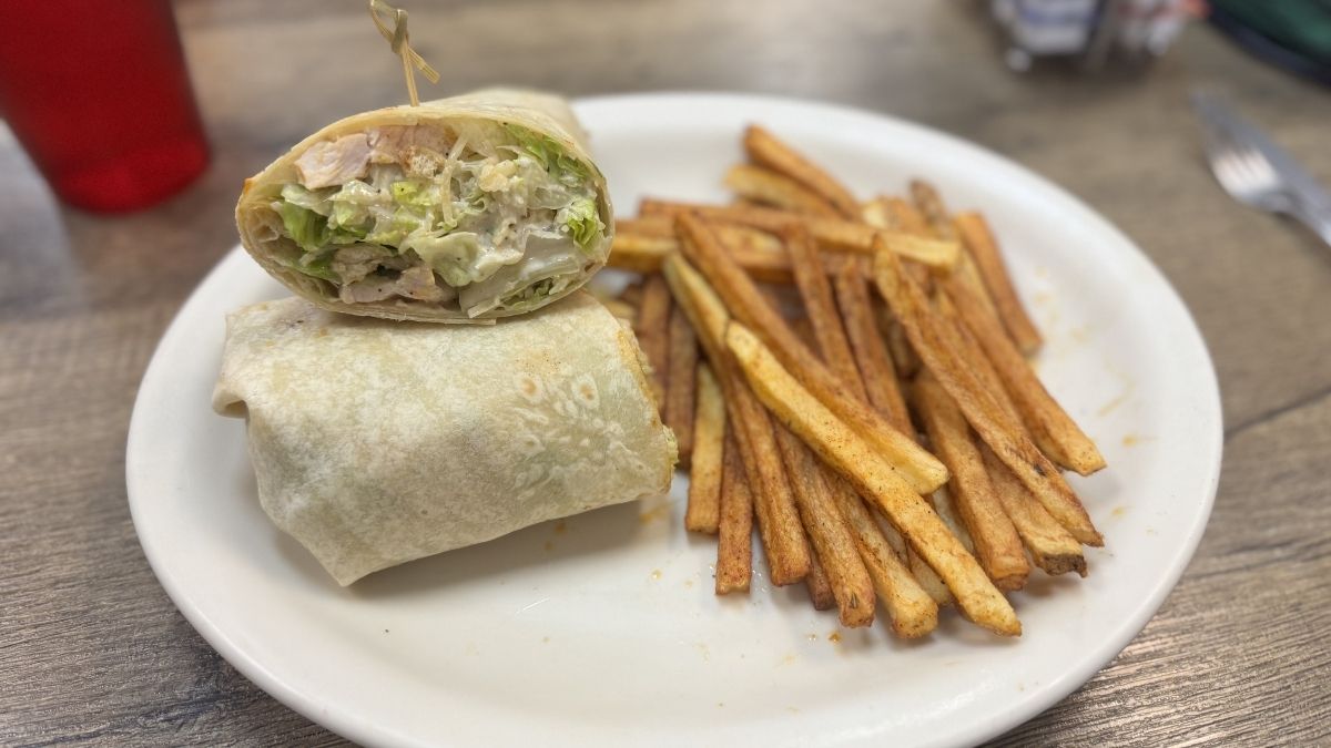 chicken caesar wrap with crispy fries served at diego’s farm cafe