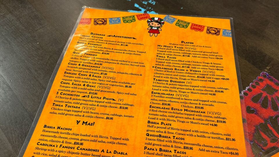 Carolina's Mexican Kitchen menu showing quesabirria tacos, chilaquiles, and traditional Mexican dishes