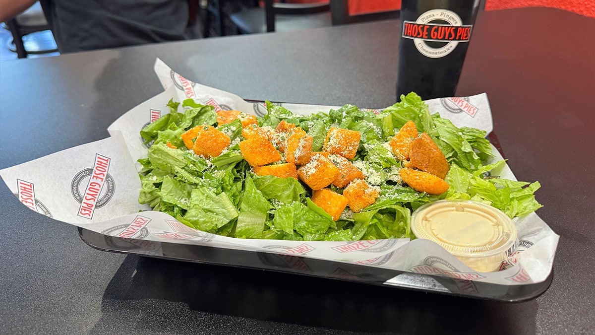 fresh caesar salad served at those guys pies with crisp romaine and parmesan