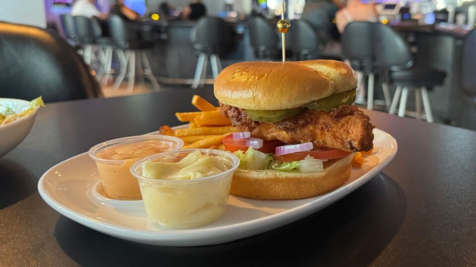 Crispy chicken sandwich served with fries at Sticks Tavern on Water Street