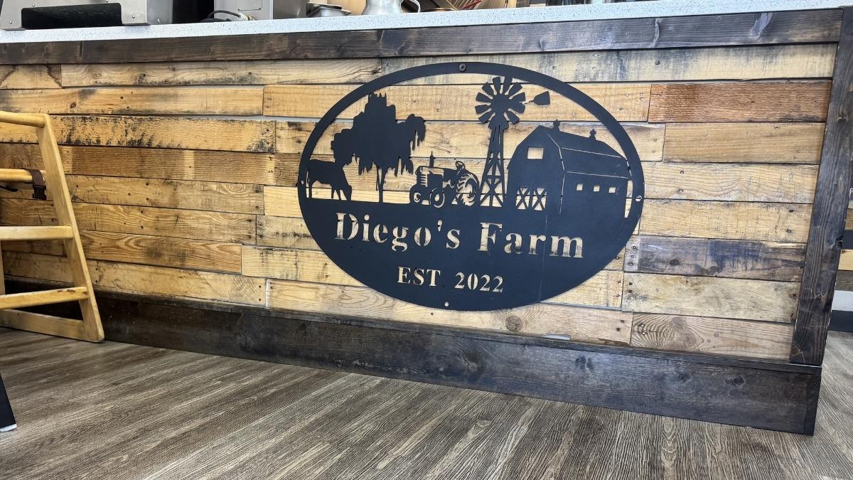 interior sign and farmhouse-style decor inside diego’s farm cafe