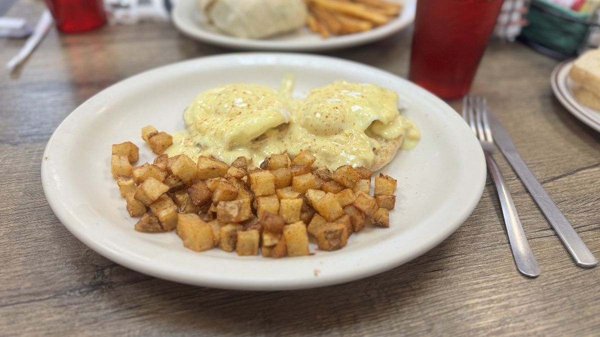 eggs benedict with crispy home fries served at diego’s farm cafe for brunch