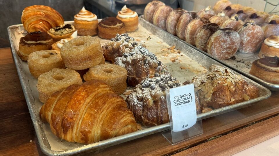 Assorted pastries and filled donuts on display at Aware Coffee in Centennial.