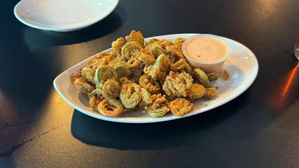Fried jalapeño appetizer with dipping sauce at Sticks Tavern