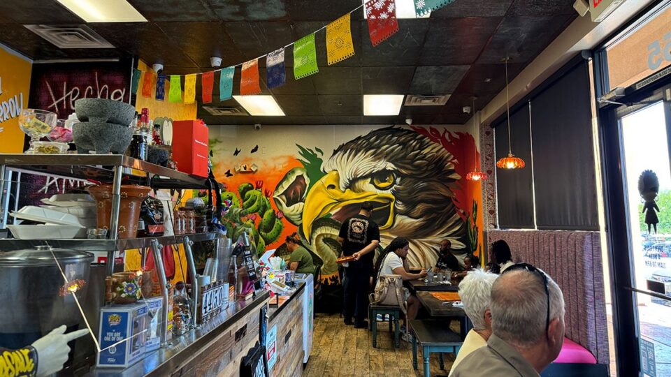 Interior of Carolina's Mexican Kitchen on North Tenaya with mural, Mexican flags and colorful decor