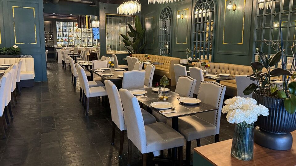 Dining room interior at Savoey Thai Eatery with tables and modern decor