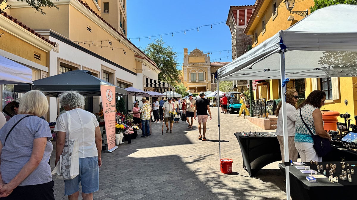 visitors exploring booths at the lake las vegas farmers market by the waterfront village