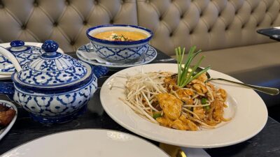 A full lunch spread with Thai dishes and drinks at Savoey Thai Eatery