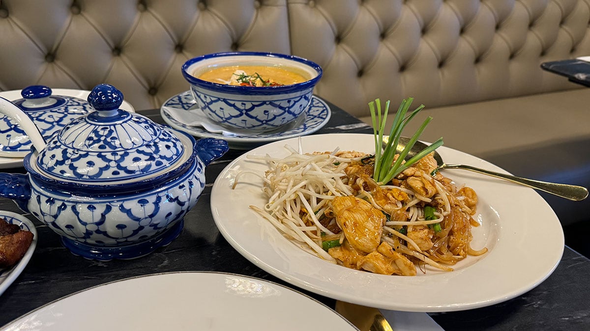 A full lunch spread with Thai dishes and drinks at Savoey Thai Eatery
