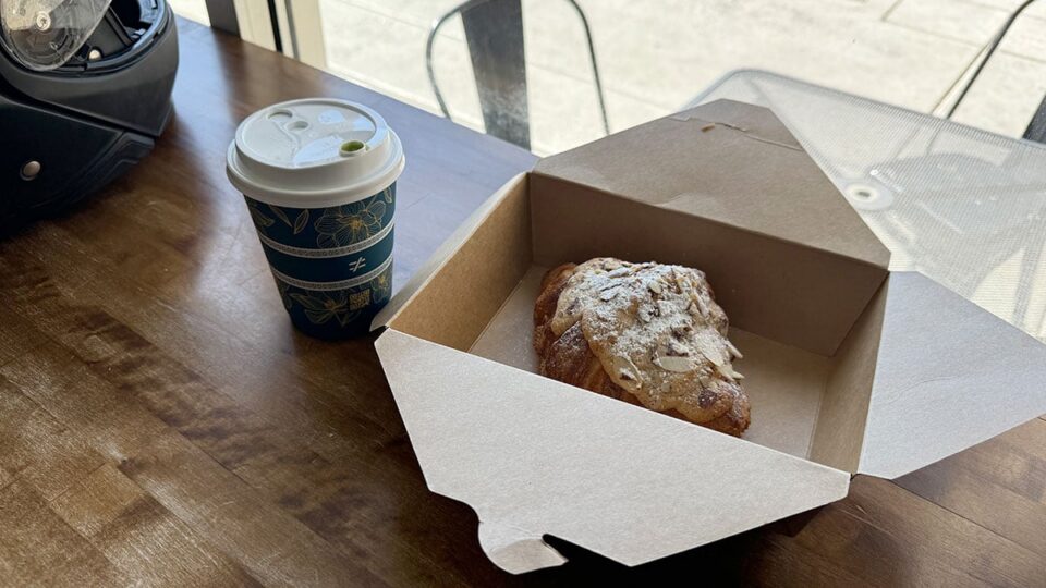 Matcha latte and almond croissant served at Aware Coffee in Centennial Las Vegas.