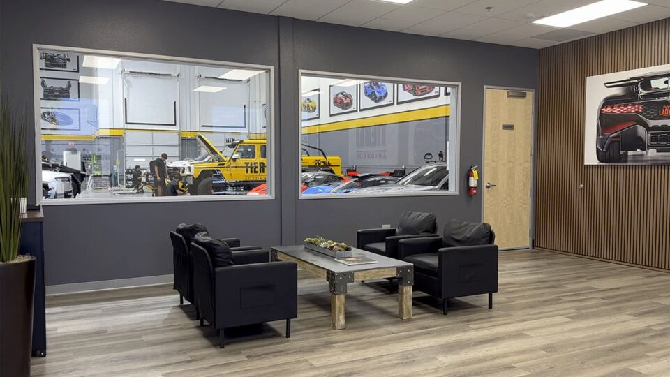 Open floor layout inside Tier 1 Autohaus allowing customers to view vehicles being worked on