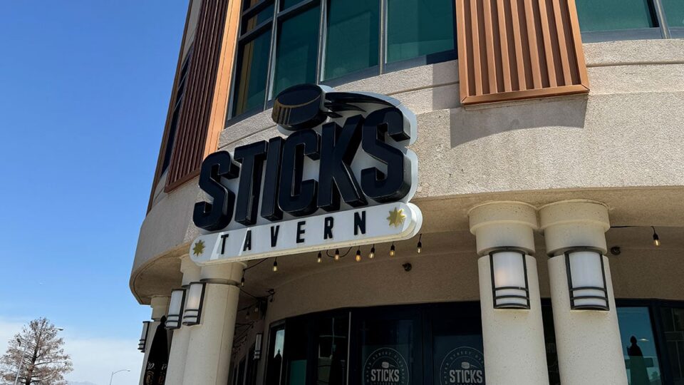 Exterior sign and entrance of Sticks Tavern on Water Street