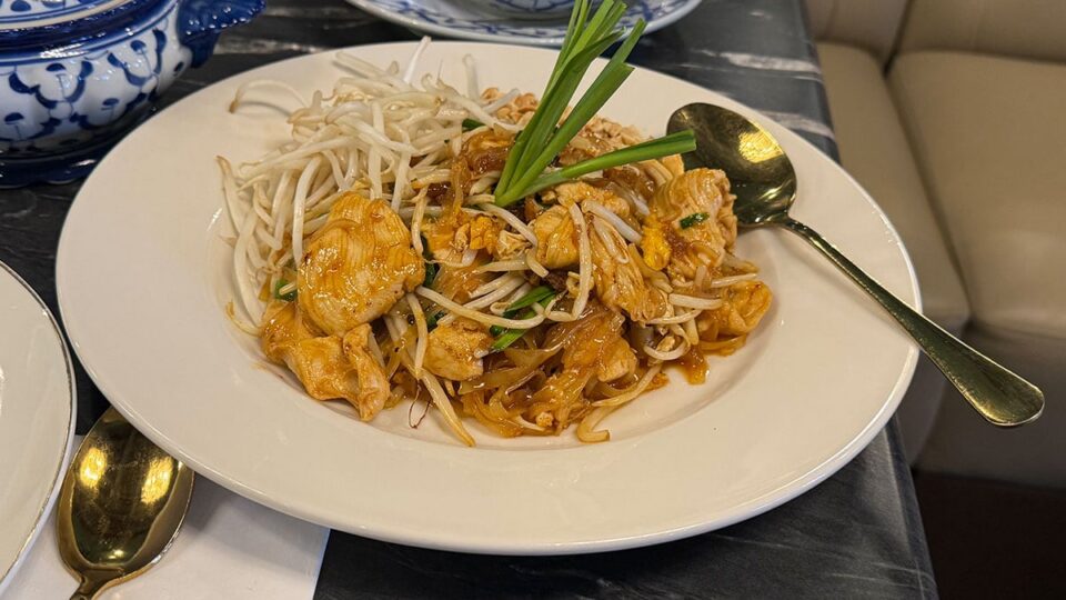 Chicken Pad Thai topped with peanuts and green onions at Savoey Thai Eatery