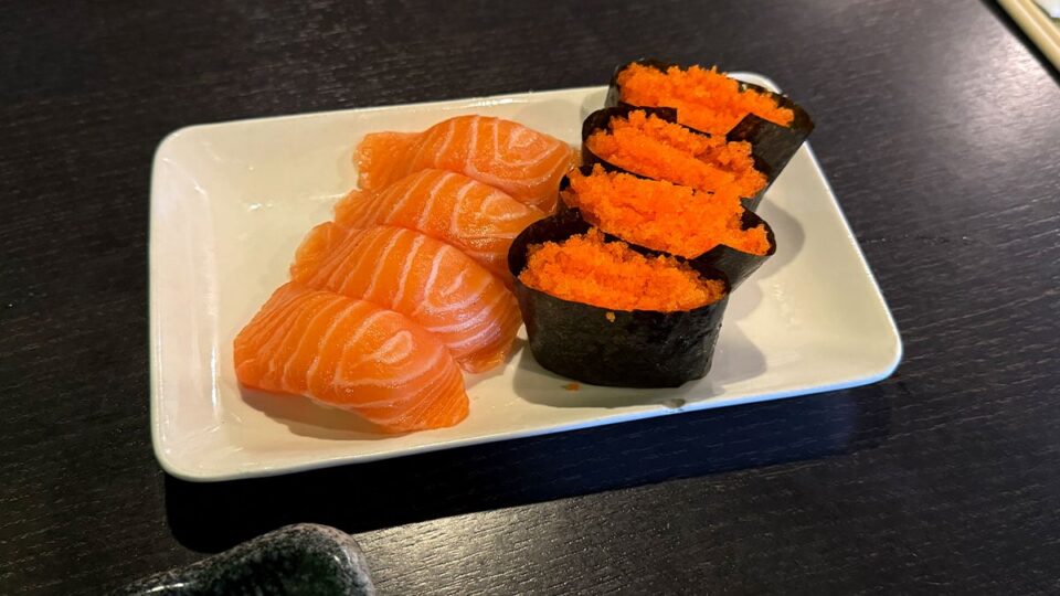 Fresh salmon nigiri and masago fish eggs served at Sasa Sushi during an all-you-can-eat lunch.